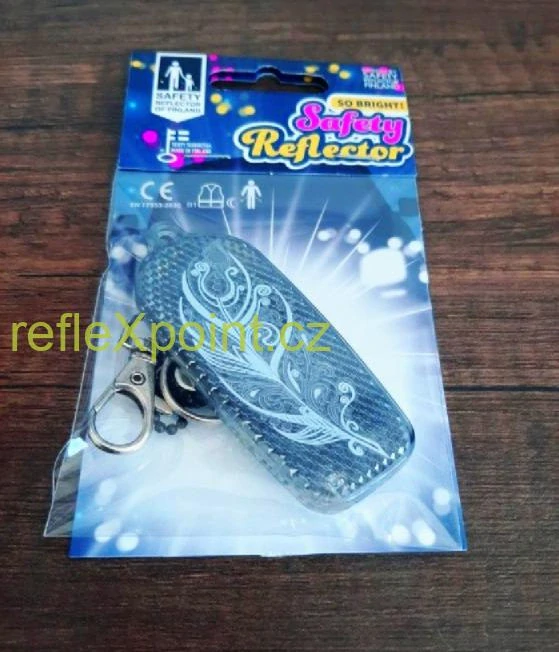 Tvrdý reflexní přívěsek - Černé peříčko